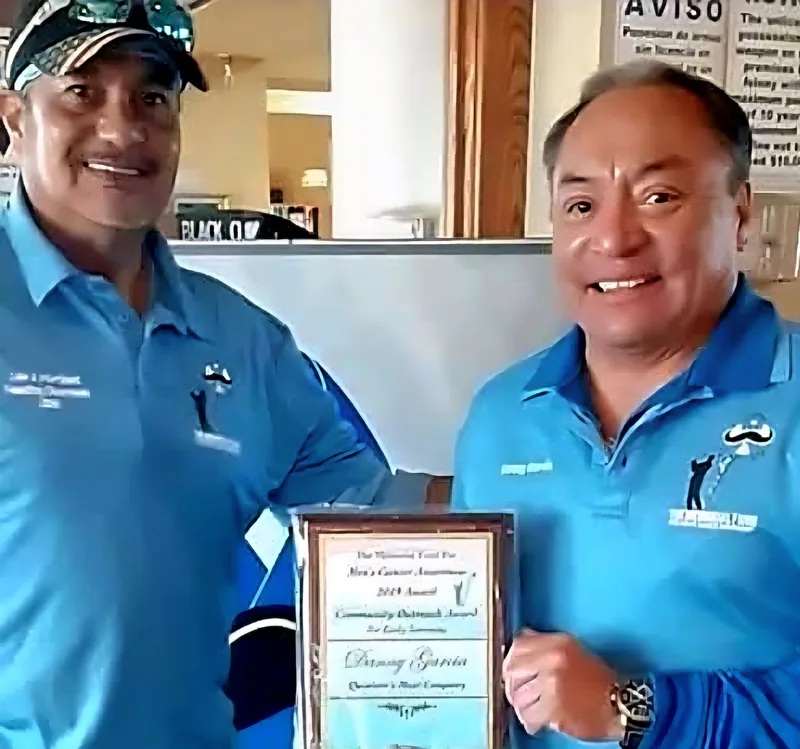 Danny Bernal of Quintero's Meat Company receiving the Fund's Community Outreach Award for early screening