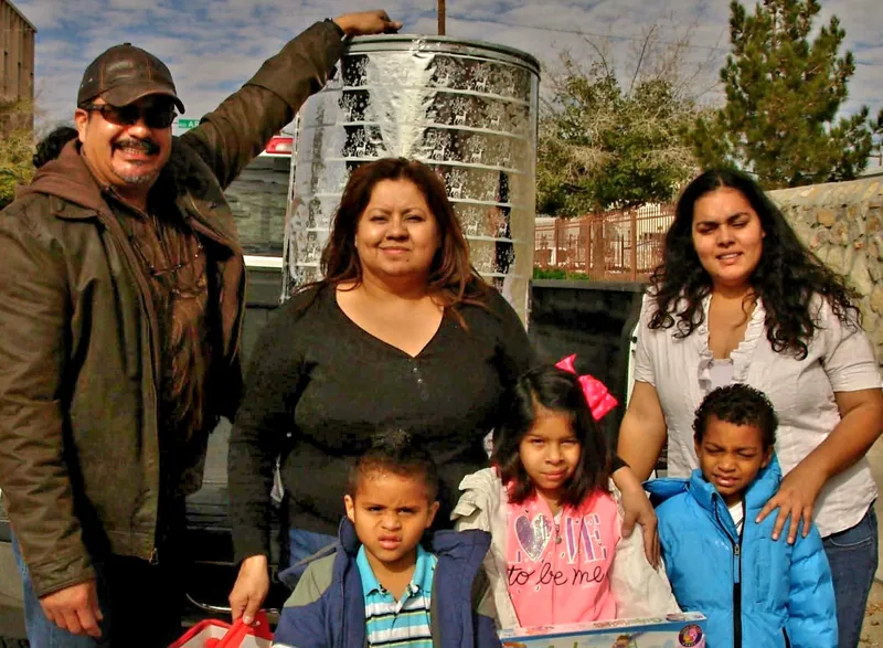 A scholarship recipient and their family at a JLV Memorial Fund event