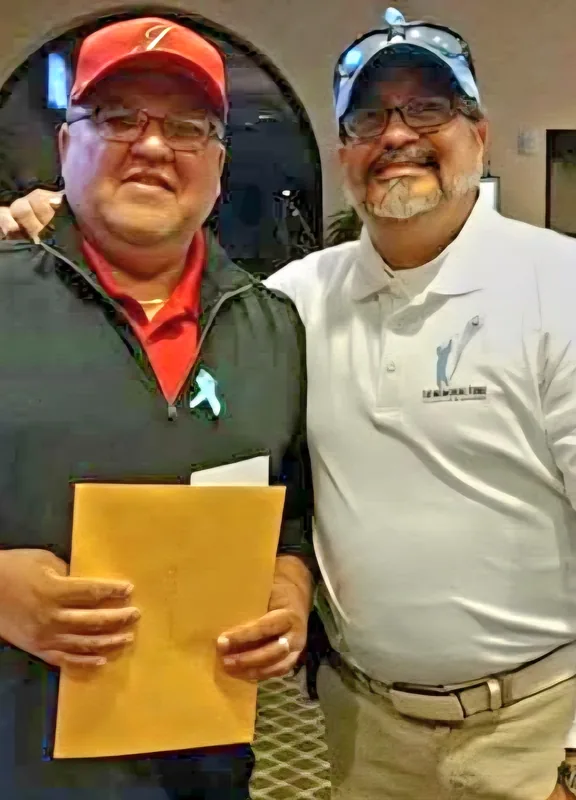 A scholarship presented to a recipient at a JLV Memorial Fund event